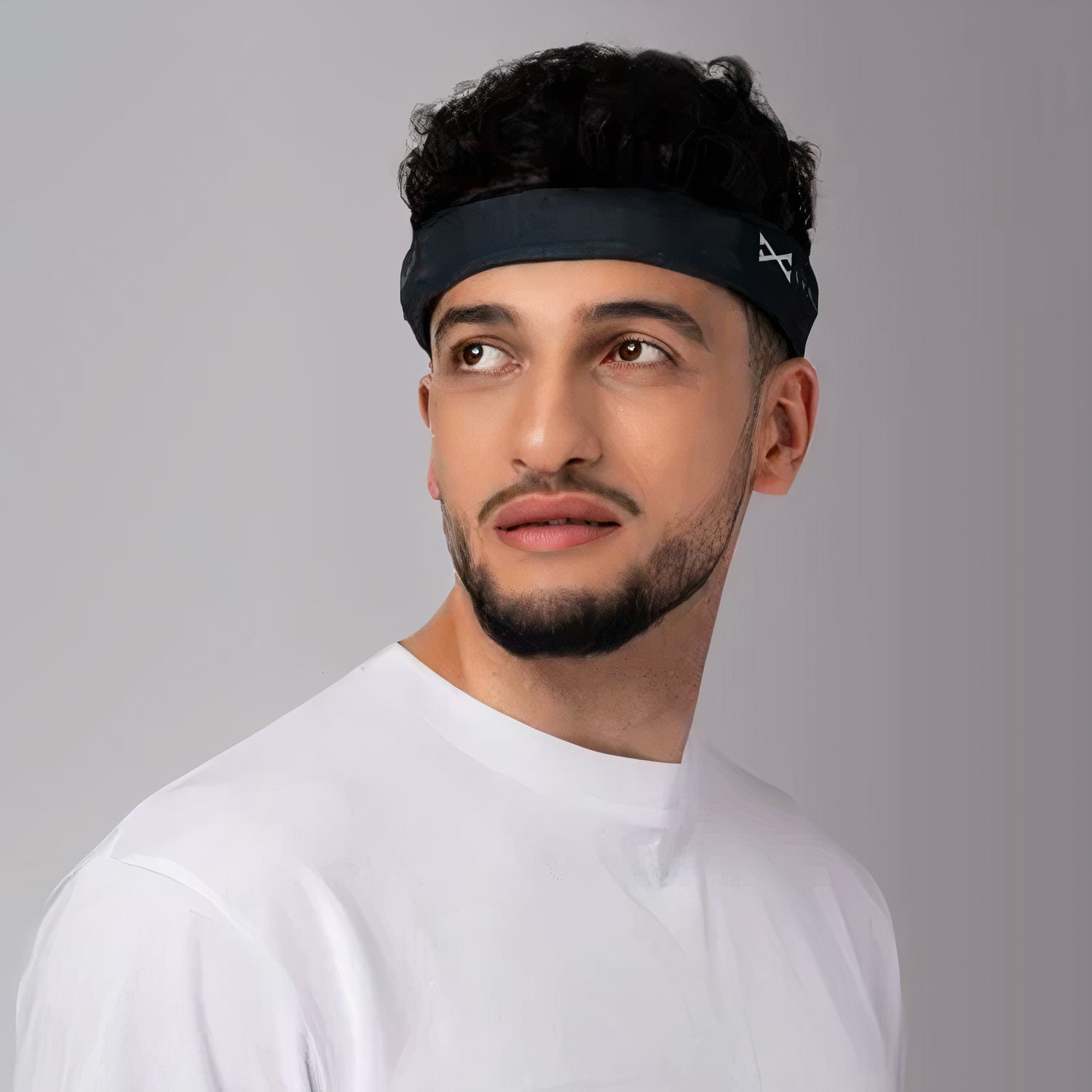 Man wearing a brain bit headband gazing into the future
