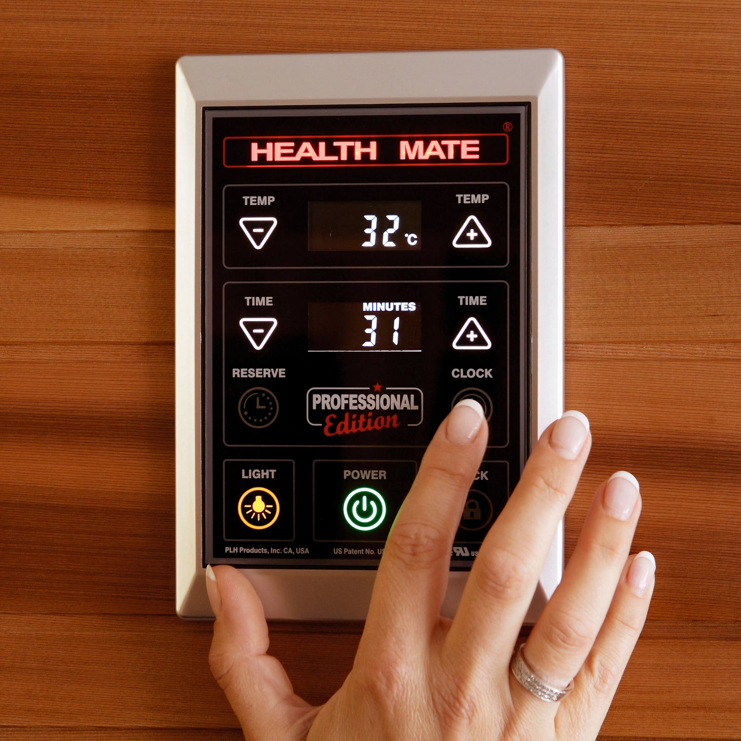 A health mate control panel close up with a female hand on it