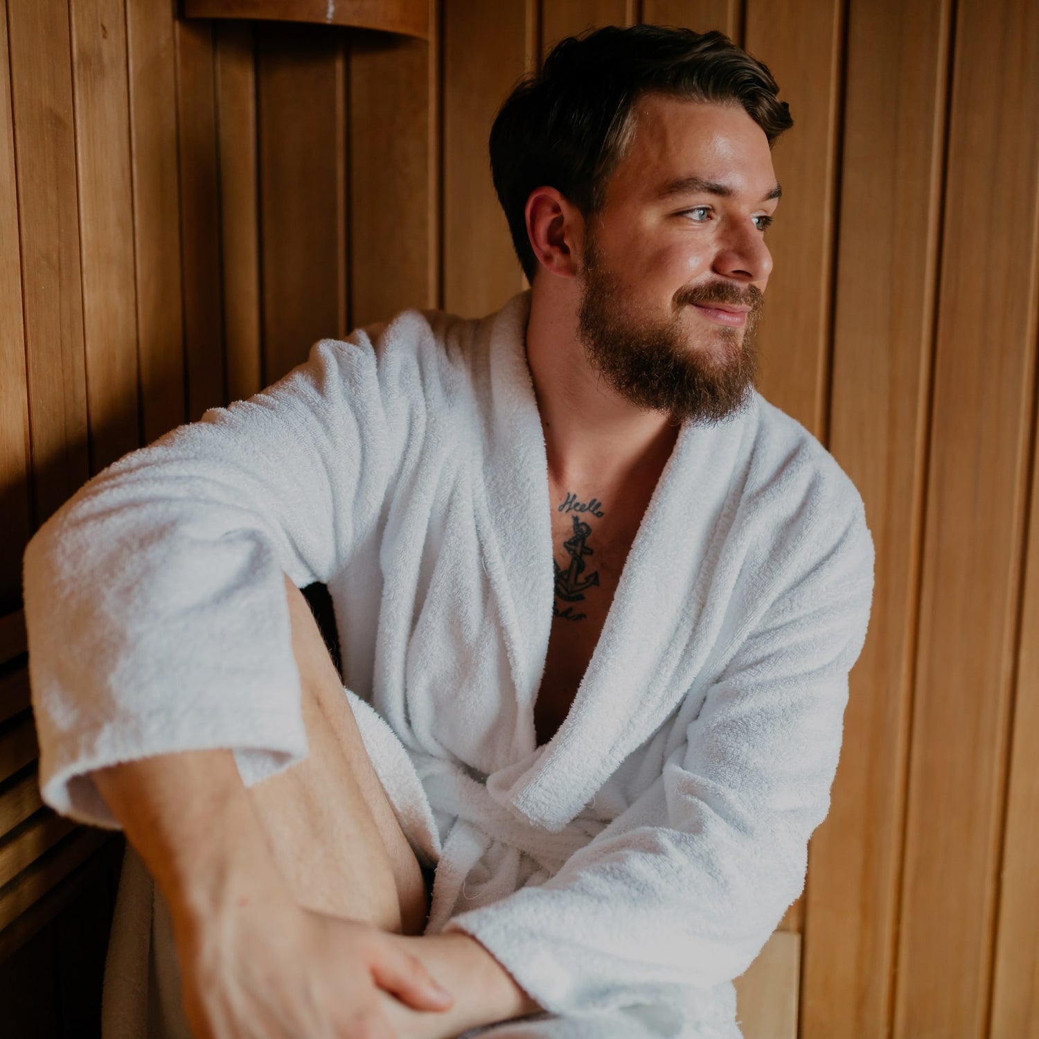 Guy smiling in a health mate sauna with a rope on