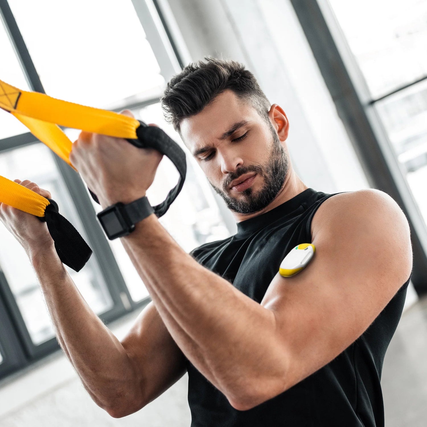 man wearing a callibri sensor on this arm whilst working out